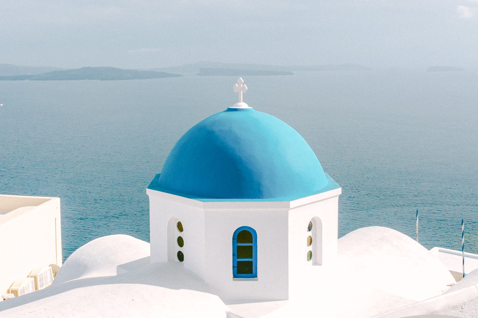photographer for destination weddings Santorini blue and white houses