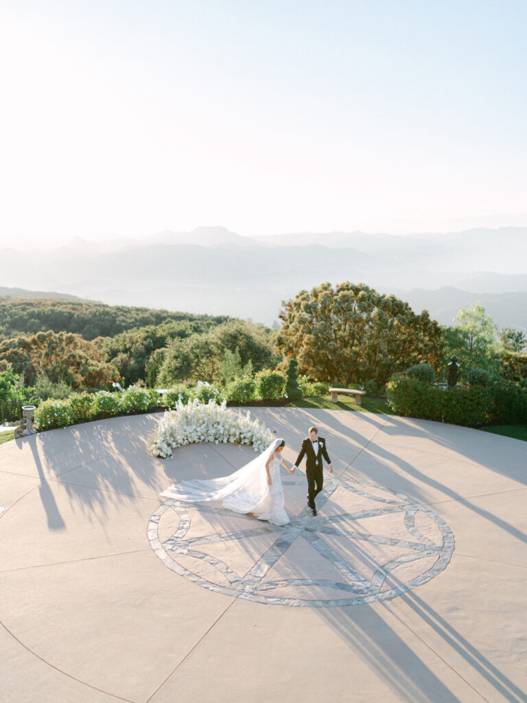 Bride and groom walking at Stone Mountain Estates