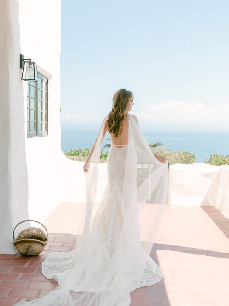 Beautiful bridal portrait shot on film of a bride in front of the ocean